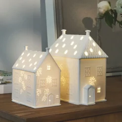 Räder Lichthaus mit Ranken Landhäuschen